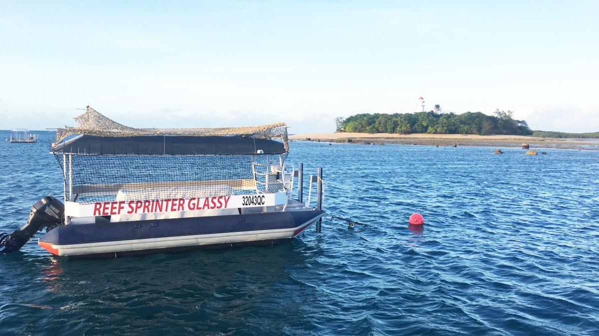 a small boat in a large body of water
