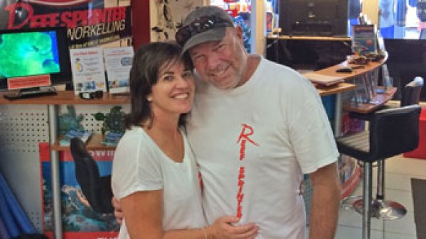 a man standing in front of a computer